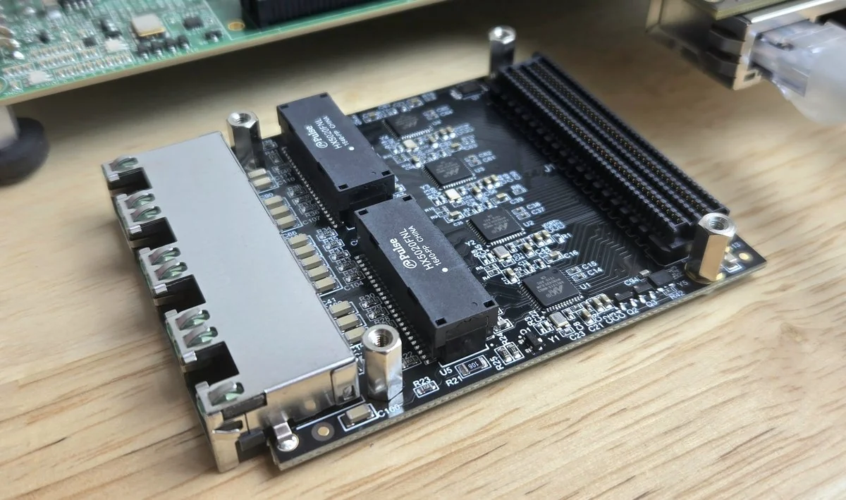 The Robust Ethernet FMC (OP041): a quad RJ45 connector, discrete Ethernet magnetics and four Marvell gigabit PHYs, with the FMC connector on the right